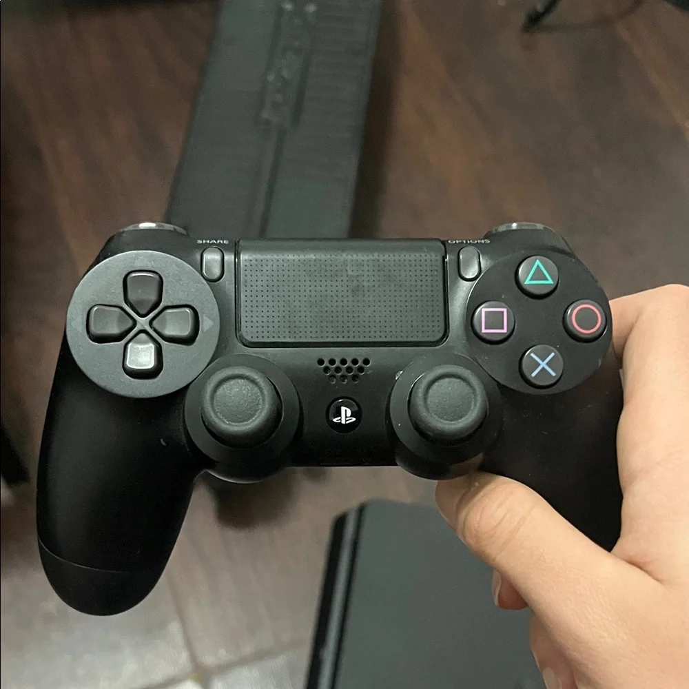 Sony PlayStation 4 Console with Black and Blue Controllers